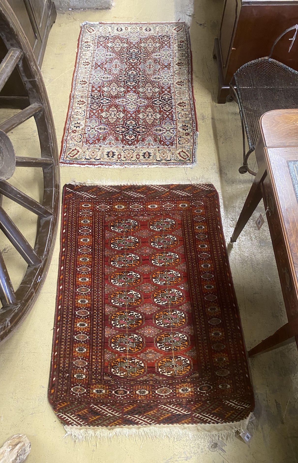 A North West Persian rug and a Bokhara rug, larger 114 x 84cm